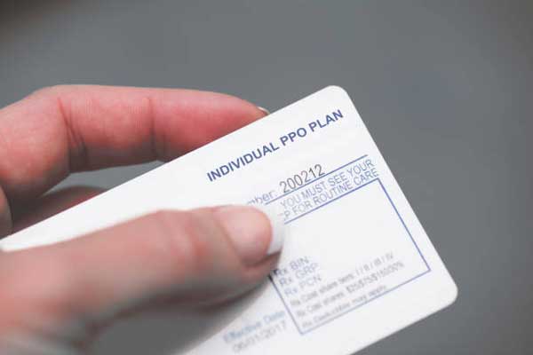 ins-cards insurance card in patients hand