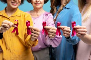 women with pink ribbons